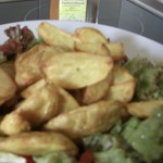Potato-Wedges mit Tandoori Masala auf Salatbett