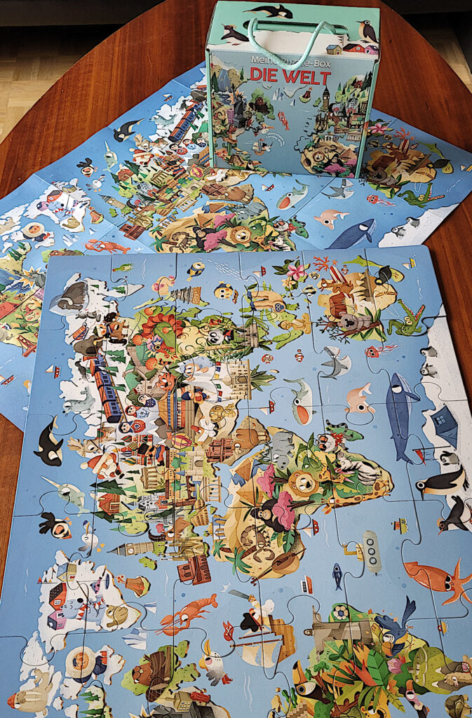 Puzzle, Plakat und Box aus "Die Welt. Meine Erste Puzzle Box" von White Star Kids