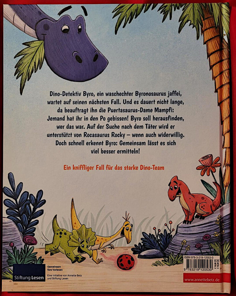 Rückseite des Kinderbuches „Die Dino-Detektive: Das Rätsel um den Popo-Biss“ von Johanna Lindemann und Maïté Schmitt mit Rückentext